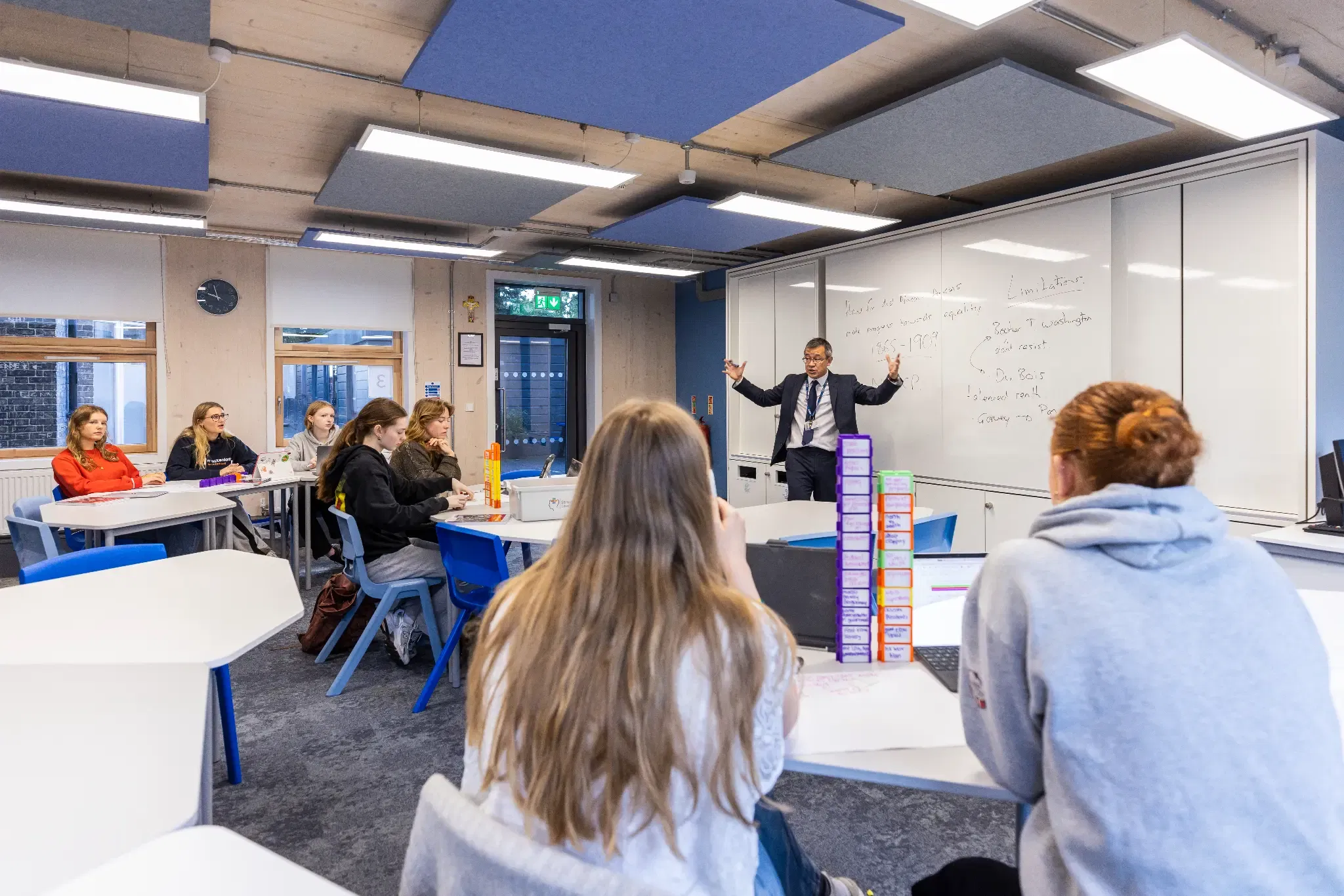 A collaborative and modern classroom layout featuring flexible seating and desks