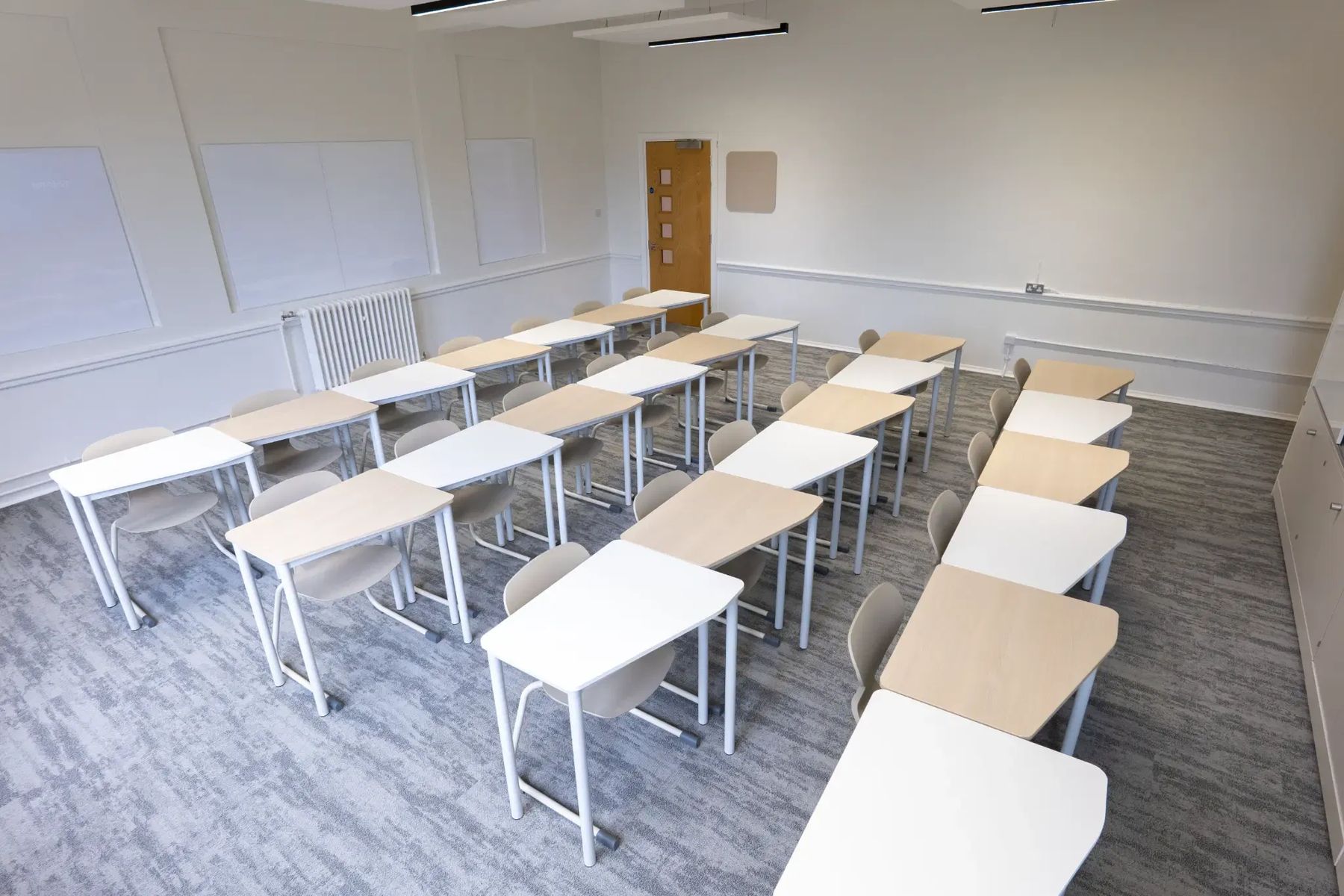 Modular desks in a clean, professional classroom environment